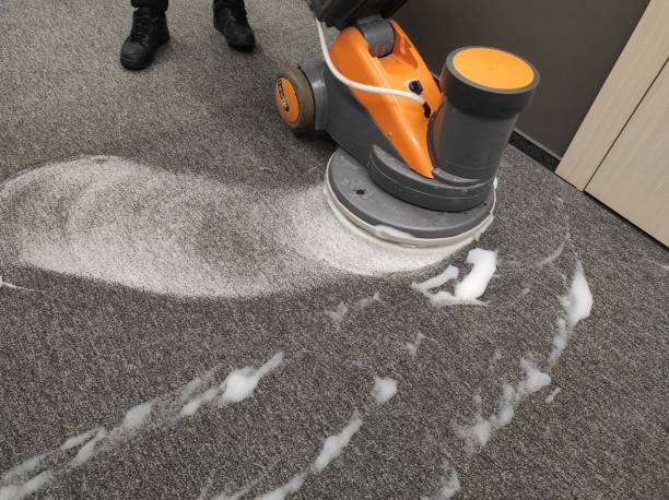 Professional steam cleaning a commercial carpet